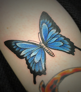 Kleine tattoo vlinder